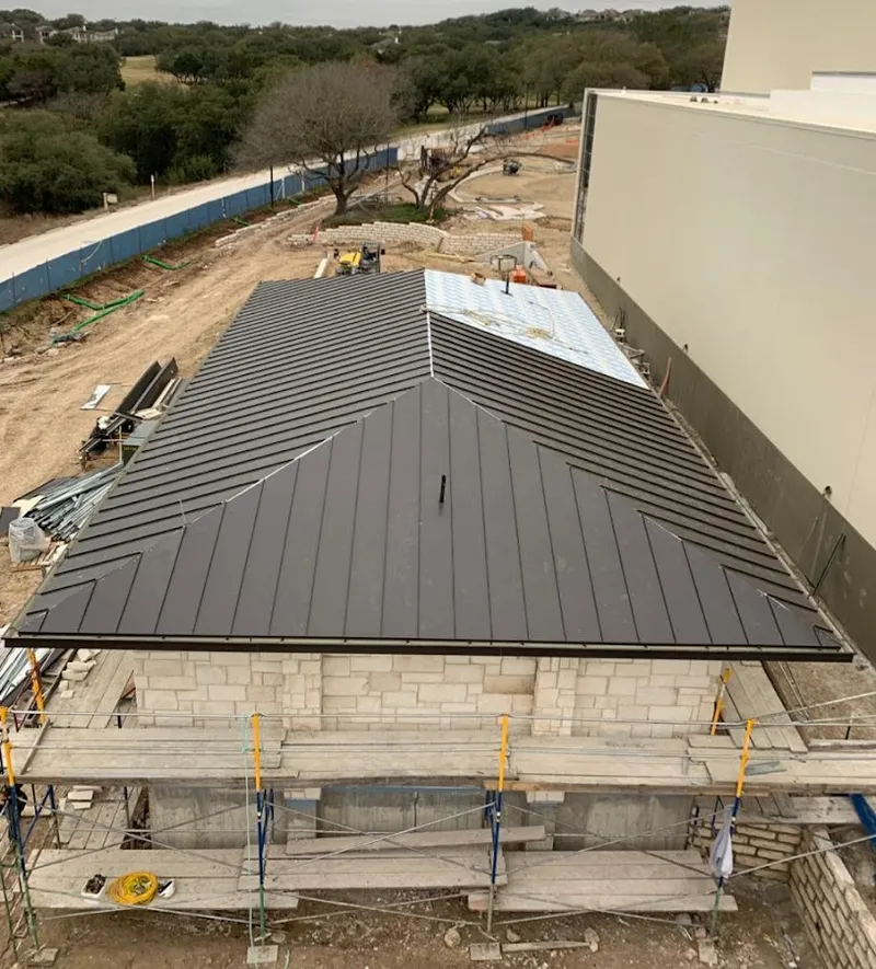 Metal roof new construction with scaffolding in Warren